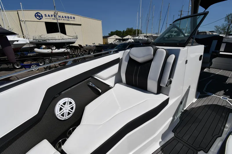 Slide: The Image of 2021 Monterey 278 Super Sport boat interior with white and black seating at Safe Harbor. - 40