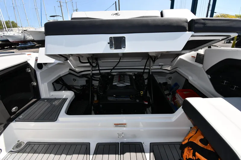 Slide: The Image of 2021 Monterey 278 Super Sport boat engine compartment with open hatch. - 43