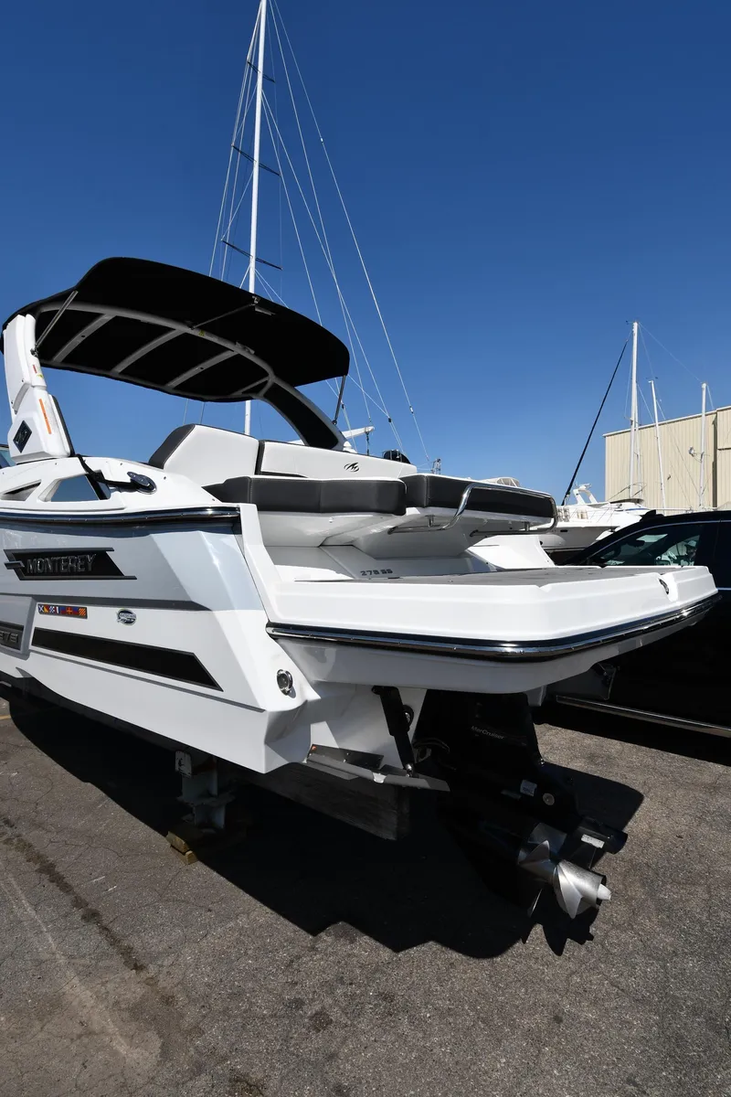 Slide: The Image of 2021 Monterey 278 Super Sport boat with sleek design and black canopy. - 5