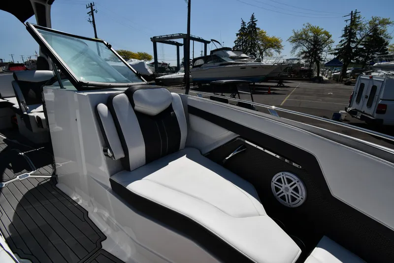 Slide: The Image of 2021 Monterey 278 Super Sport boat interior with white and black seating. - 39