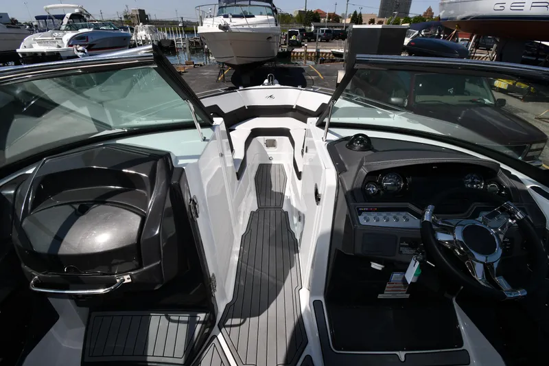 Slide: The Image of 2021 Monterey 278 Super Sport boat interior with dashboard and seating. - 34