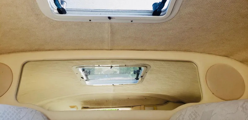 Slide: The Image of Interior cabin view of a 2001 Sea Ray 225 Weekender boat with a sunroof. - 7