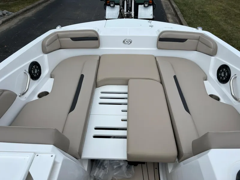Slide: The Image of 2024 Hurricane SunDeck Sport 205 IO boat interior with beige seating and white deck. - 11
