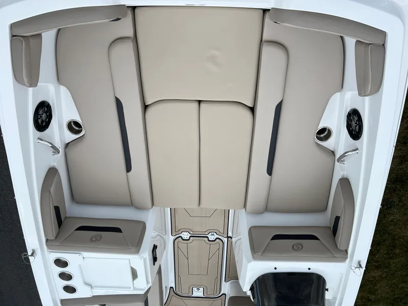 Slide: The Image of 2024 Hurricane SunDeck Sport 205 IO boat interior with beige seating. - 13