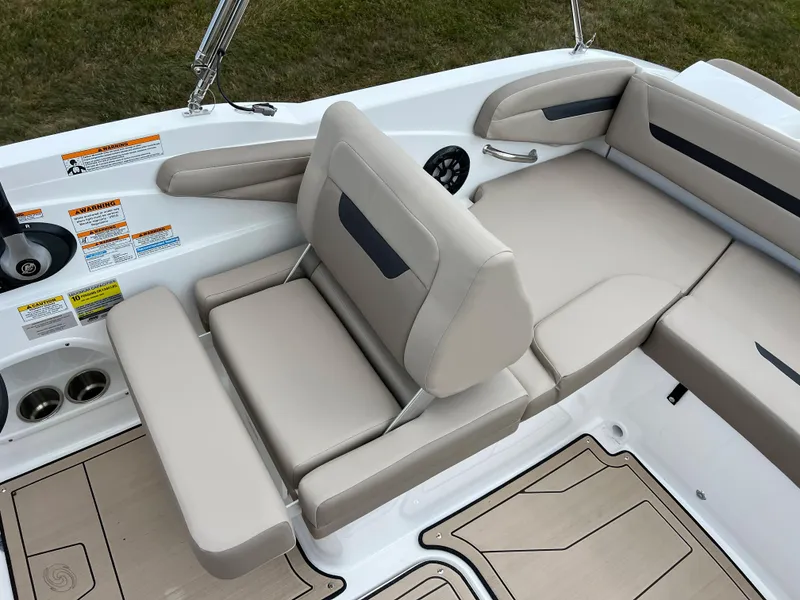 Slide: The Image of 2024 Hurricane SunDeck Sport 205 IO boat interior with beige seating and modern design. - 19