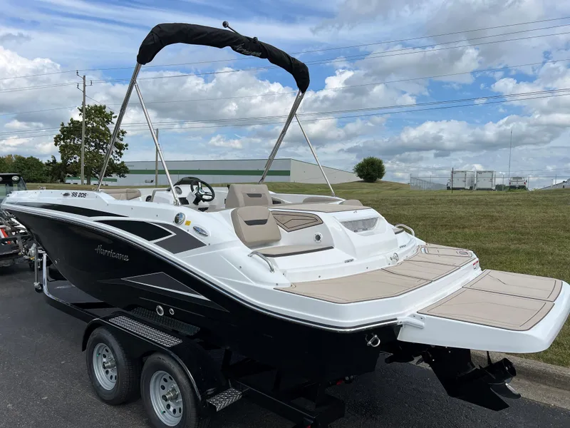 Slide: The Image of 2024 Hurricane SunDeck Sport 205 IO boat on a trailer. - 6