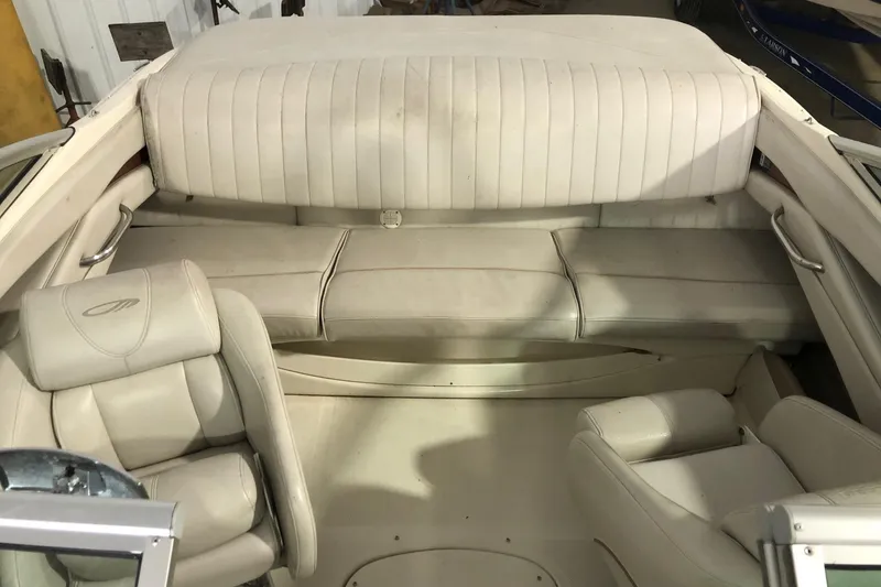 Slide: The Image of 2002 Maxum 1900 SR boat interior with beige seating and upholstery. - 11