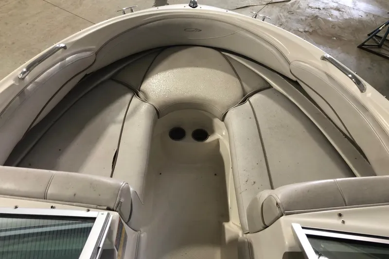 Slide: The Image of 2002 Maxum 1900 SR boat interior with beige seating. - 12