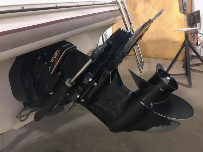 Slide: The Image of 2002 Maxum 1900 SR boat with Mercury outboard motor in a garage. - 3