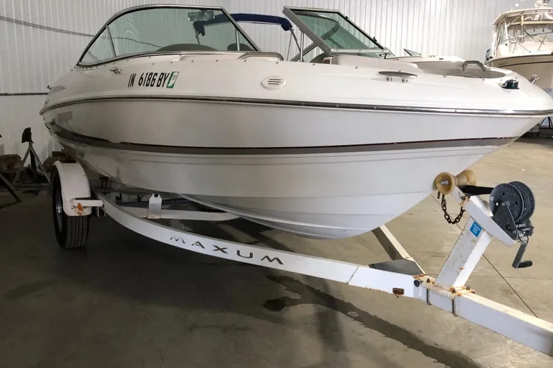 Slide: The Image of 2002 Maxum 1900 SR boat on trailer in indoor storage. - 5