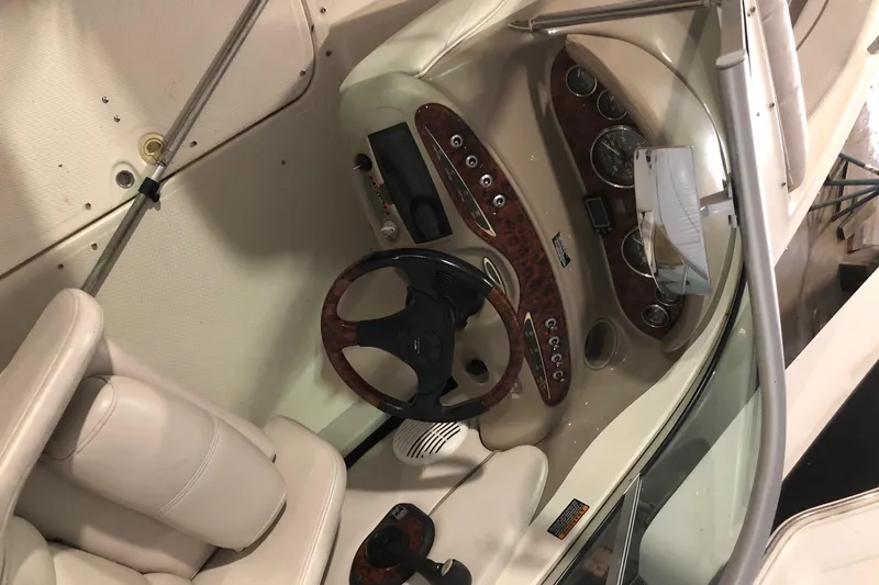 Slide: The Image of 2002 Maxum 1900 SR boat interior with steering wheel and control panel. - 7