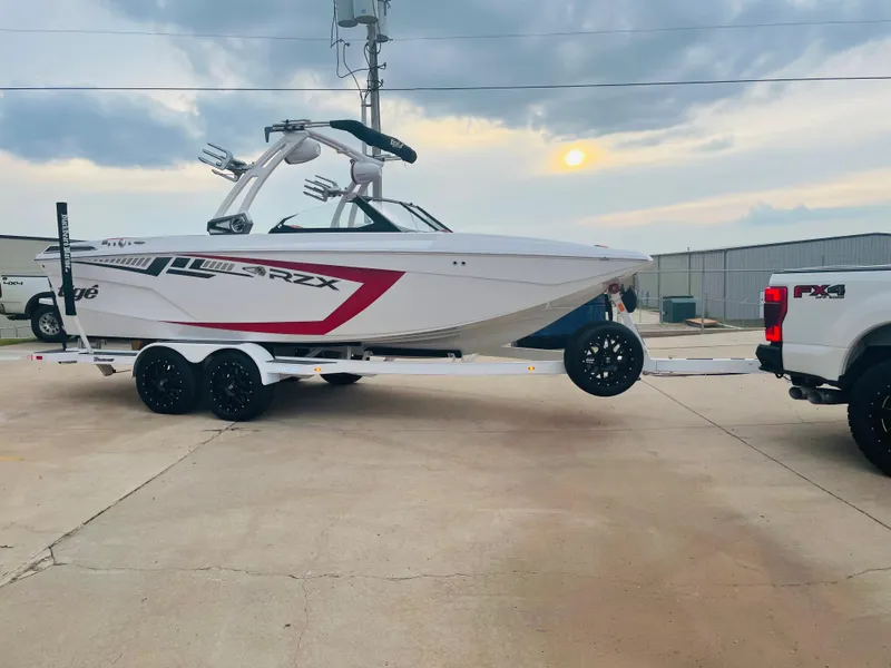 Slide: The Image of 2021 Tigé 22RZX boat on trailer, ready for transport. - 10