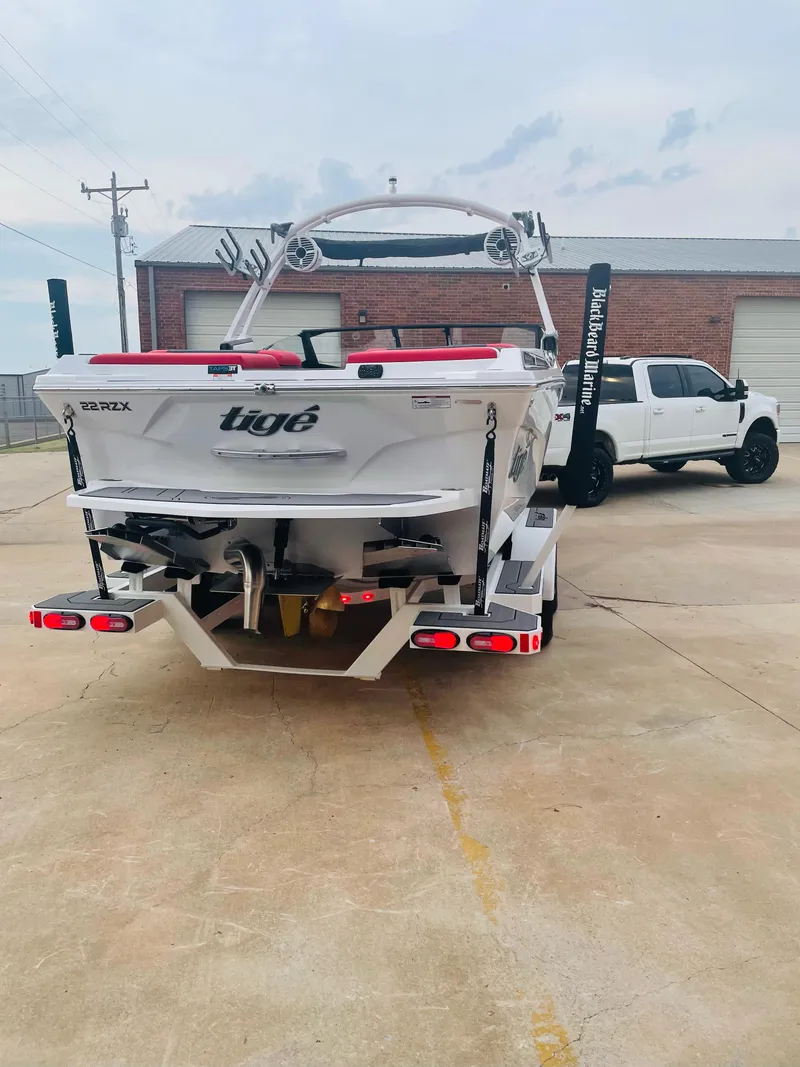 Slide: The Image of 2021 Tigé 22RZX boat on trailer, rear view. - 9