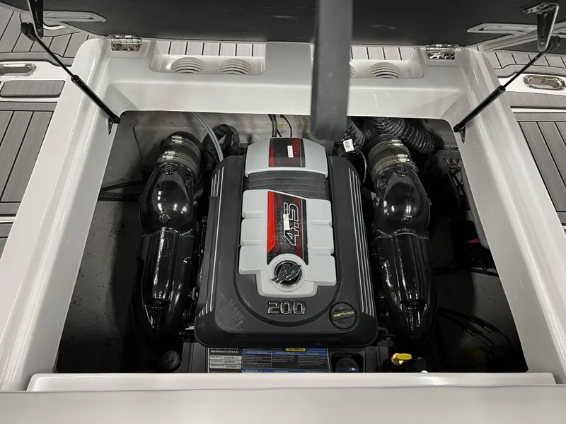 Slide: The Image of 2024 Hurricane SunDeck 187 IO engine compartment showcasing powerful 4.5L 200 HP engine. - 14