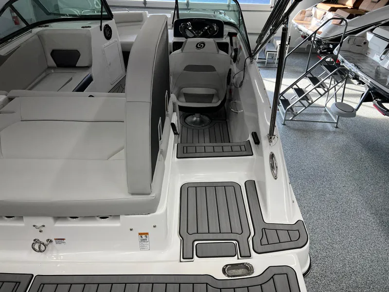 Slide: The Image of 2024 Hurricane SunDeck 187 IO boat interior with sleek seating and modern design. - 5