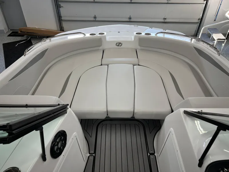 Slide: The Image of 2024 Hurricane SunDeck 187 IO boat interior with white seating and sleek design. - 8