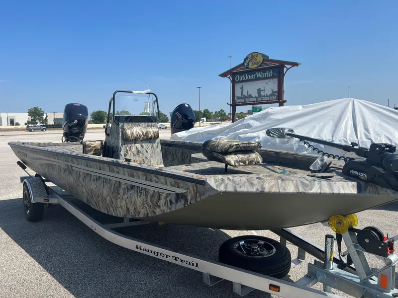 The Image of 2024 Ranger RB190 boat in camouflage pattern on a trailer at Outdoor World. - 0