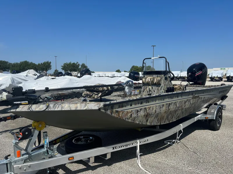 Slide: The Image of 2024 Ranger RB190 boat on trailer, camo design, equipped with Minn Kota trolling motor. - 1