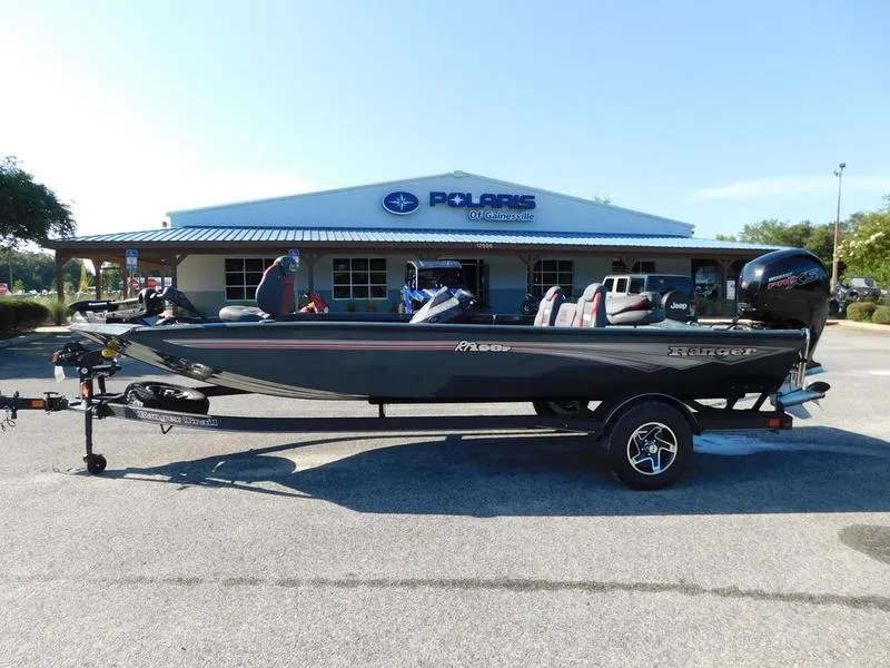 The Image of 2024 Ranger RT198P fishing boat on trailer outside Polaris dealership. - 0