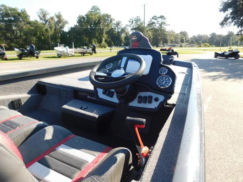 Slide: The Image of 2024 Ranger RT198P boat cockpit with steering wheel and control panel. - 11