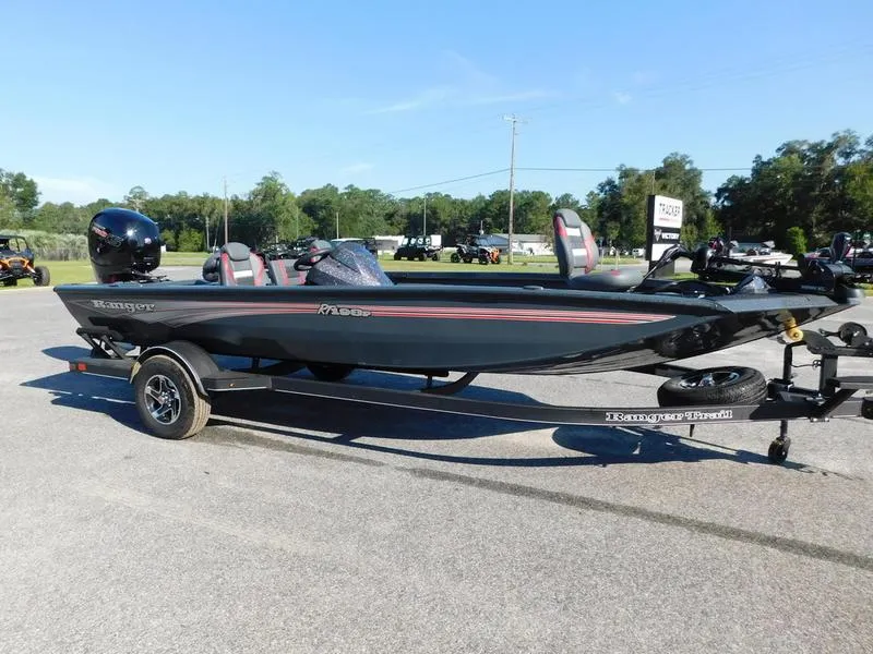 Slide: The Image of 2024 Ranger RT198P fishing boat on trailer in outdoor setting. - 2
