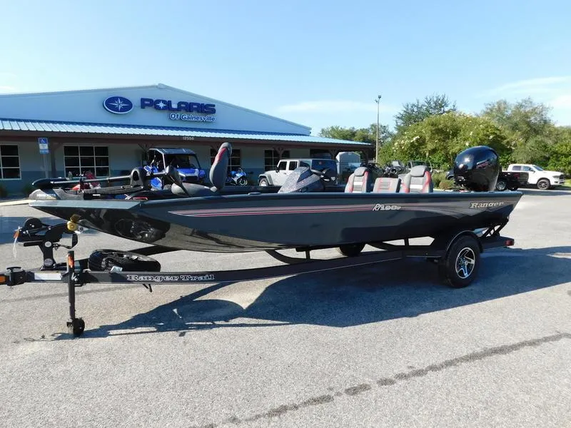 Slide: The Image of 2024 Ranger RT198P fishing boat on trailer outside Polaris dealership. - 3