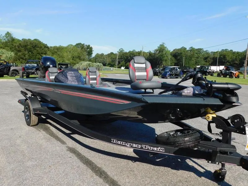 Slide: The Image of 2024 Ranger RT198P fishing boat on a trailer in a parking lot. - 5