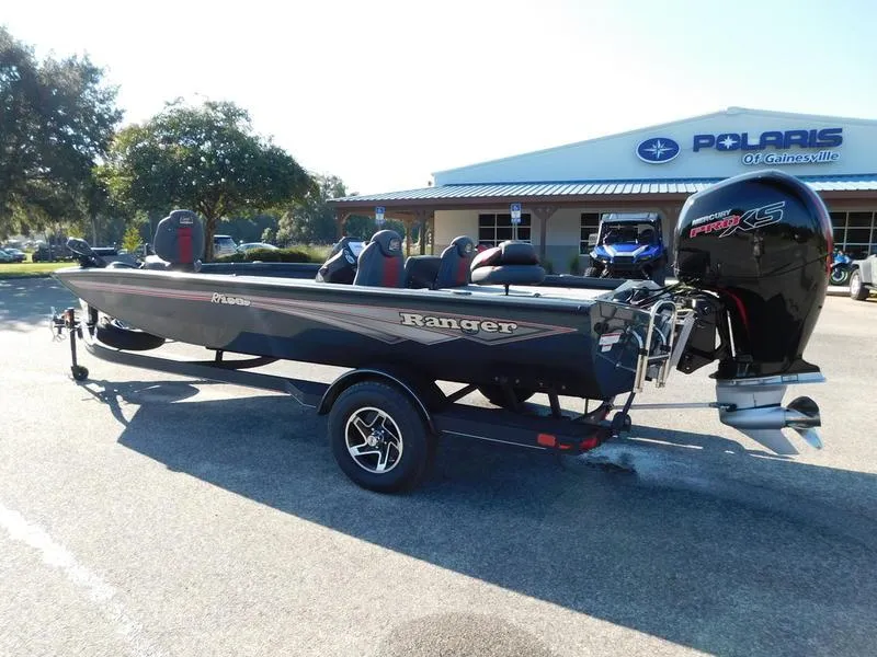 Slide: The Image of 2024 Ranger RT198P fishing boat parked outside Polaris dealership. - 6