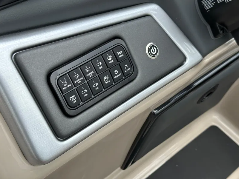 Slide: The Image of Control panel of the 2024 Ranger Reata 223C boat with various function buttons. - 16