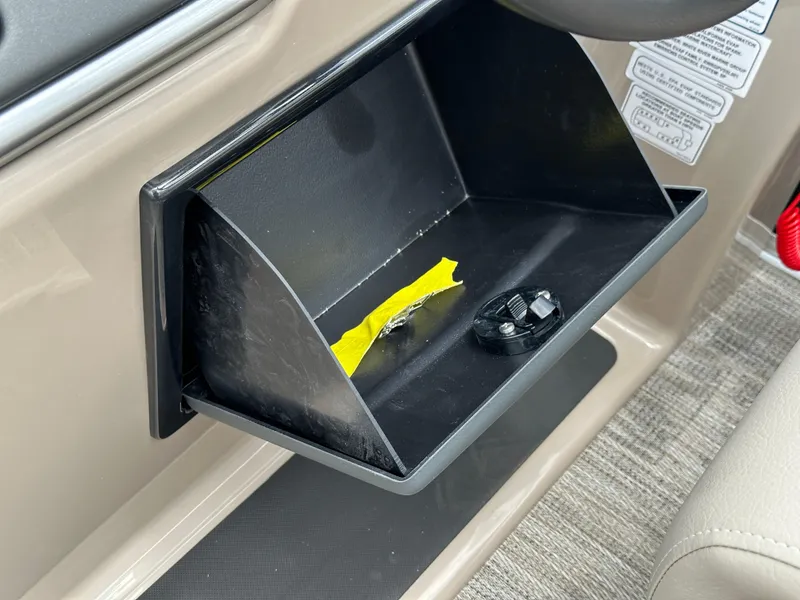 Slide: The Image of Open glove compartment in 2024 Ranger Reata 223C boat. - 19