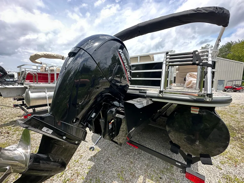 Slide: The Image of 2024 Ranger Reata 223C boat with Mercury outboard motor, rear view. - 4