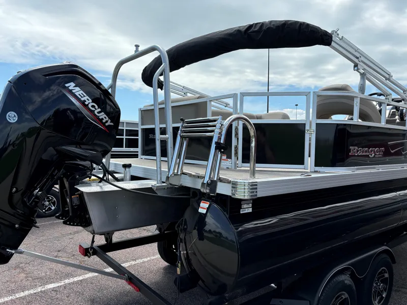Slide: The Image of 2024 Ranger Reata 200C pontoon boat with Mercury outboard motor. - 4
