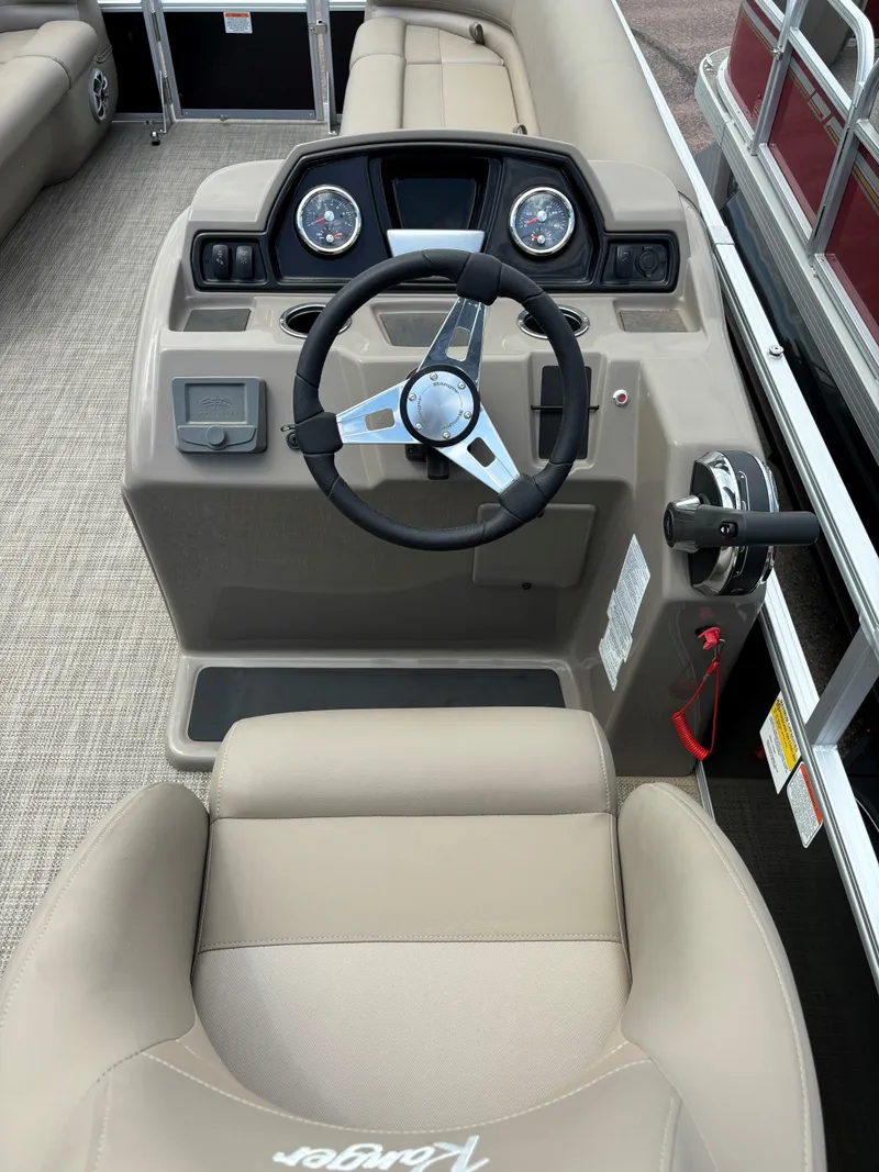 Slide: The Image of 2024 Ranger Reata 200C boat cockpit with steering wheel and dashboard. - 5