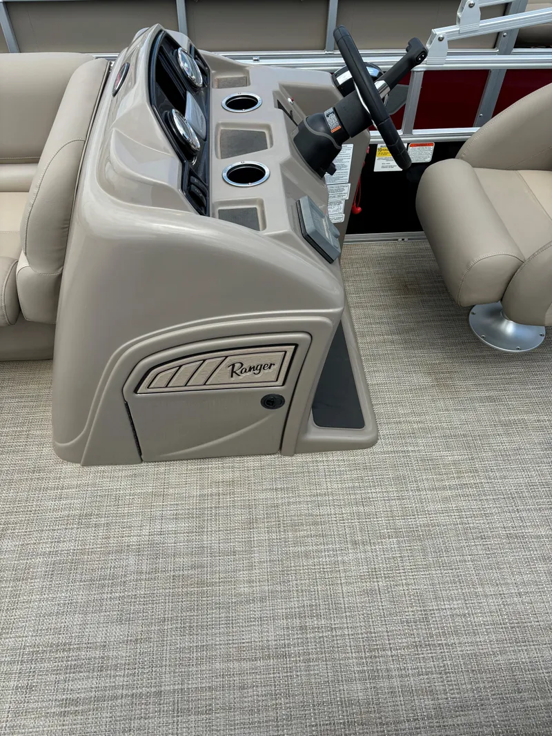 Slide: The Image of 2024 Ranger Reata 200C boat console with steering wheel and cup holders. - 7