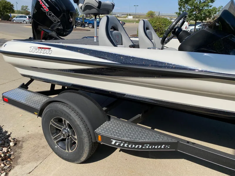 Slide: The Image of 2024 Triton 179 TrX boat on trailer, side view. - 3