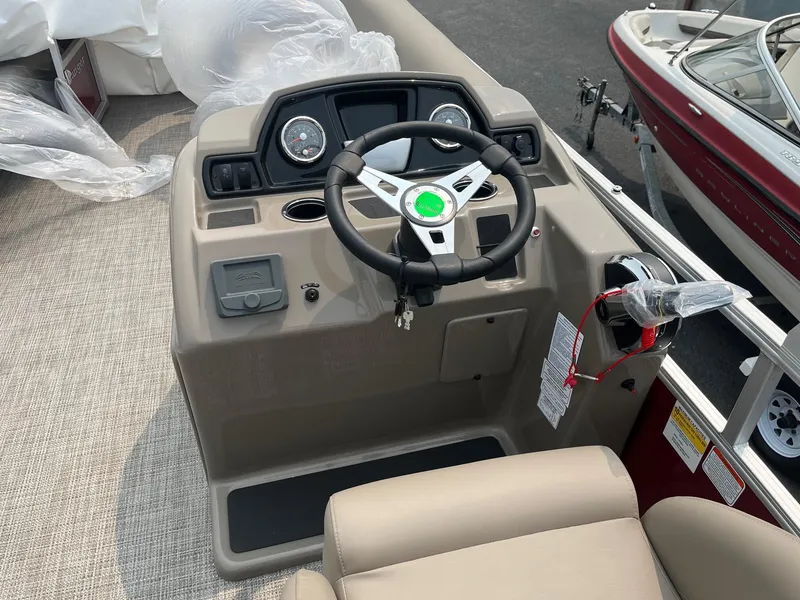 Slide: The Image of 2024 Ranger Reata 200C boat console with steering wheel and controls. - 20