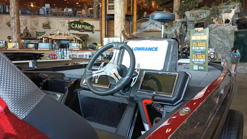 The Image of 2024 Ranger Z520R Ranger Cup Equipped boat interior with Lowrance electronics at a camping store. - 0