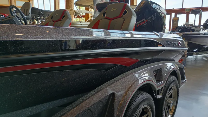 Slide: The Image of 2024 Ranger Z520R Ranger Cup Equipped boat in showroom, side view. - 2