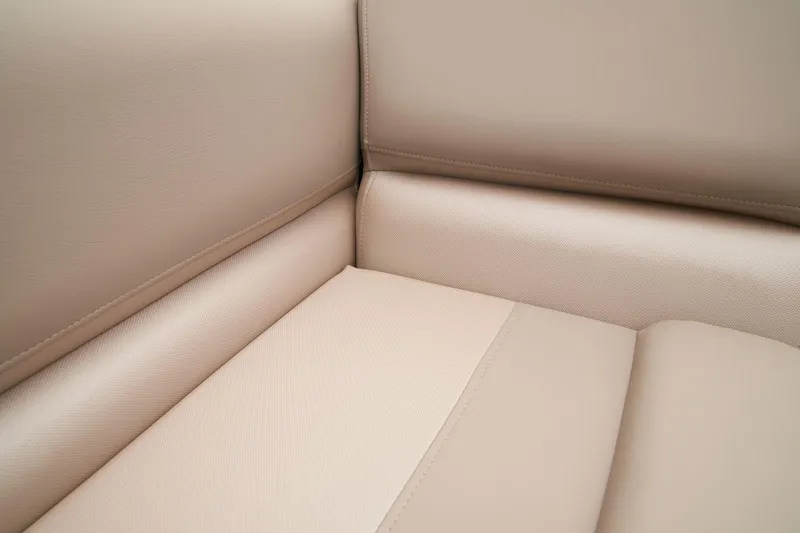 Slide: The Image of 2024 Ranger Reata 200C beige leather seating close-up. - 39