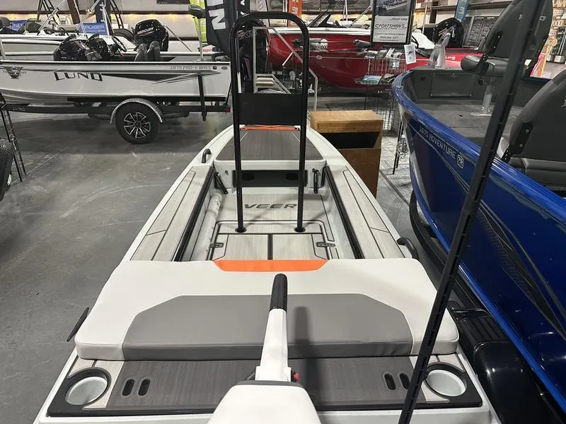 Slide: The Image of 2023 Veer V13 boat on display in showroom, featuring modern design and seating. - 3