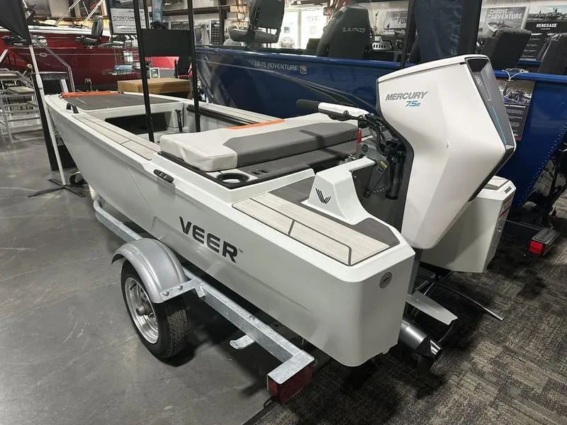 Slide: The Image of 2023 Veer V13 boat with Mercury 25hp engine on a trailer in showroom. - 4