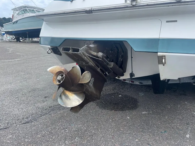 Slide: The Image of 1998 Cobalt 252 boat stern with propeller on dry dock. - 8