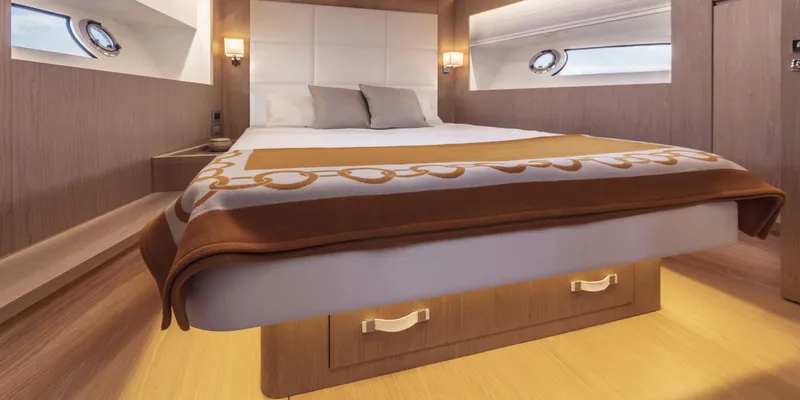 Slide: The Image of Luxurious bedroom interior of 2024 Solaris 57 Lobster yacht with elegant bedding and lighting. - 11