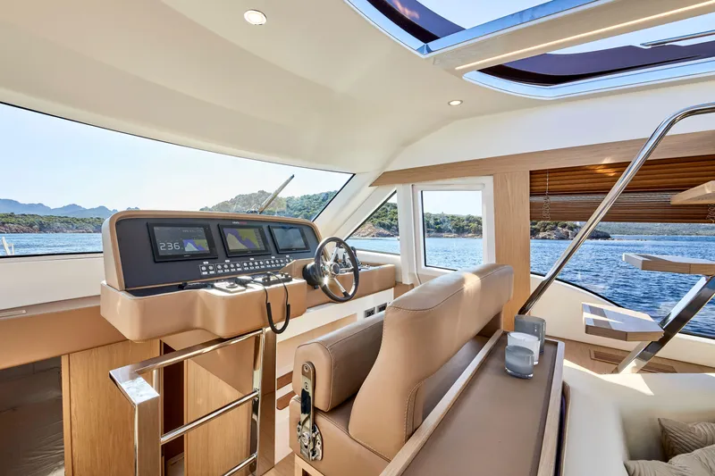 Slide: The Image of Luxurious interior of 2024 Solaris 57 Lobster yacht with modern helm and scenic ocean view. - 9