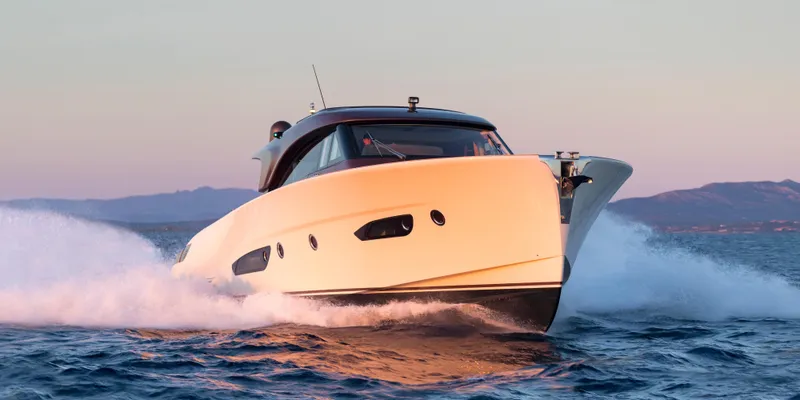 Slide: The Image of 2024 Solaris 57 Lobster yacht cruising on open water at sunset. - 3