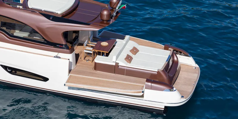 Slide: The Image of 2024 Solaris 57 Lobster yacht with elegant deck design on blue ocean water. - 5