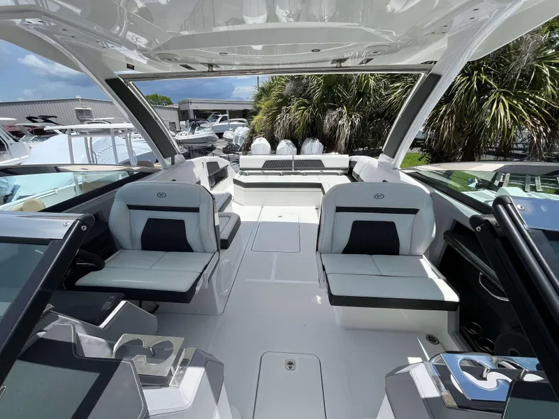 Slide: The Image of 2023 Cobalt R33 boat interior with luxurious seating and modern design. - 10