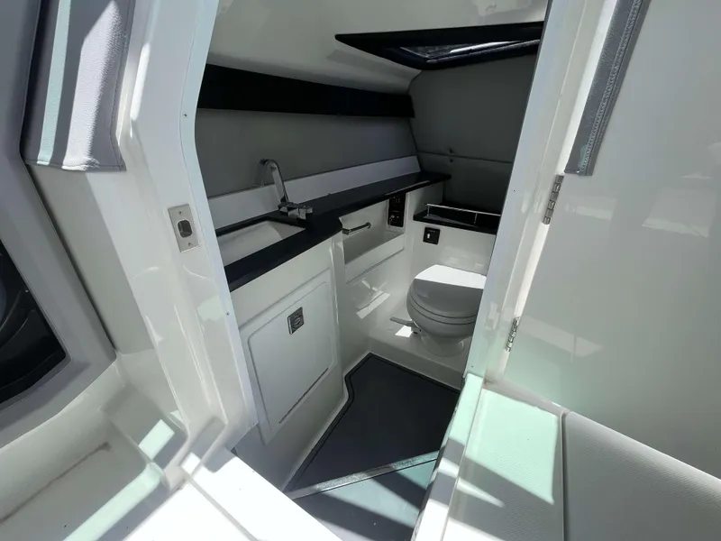 Slide: The Image of 2023 Cobalt R33 boat interior bathroom with modern fixtures and sleek design. - 13
