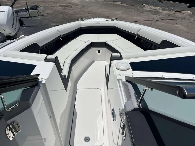 Slide: The Image of 2023 Cobalt R33 boat interior with white seating and sleek design. - 3