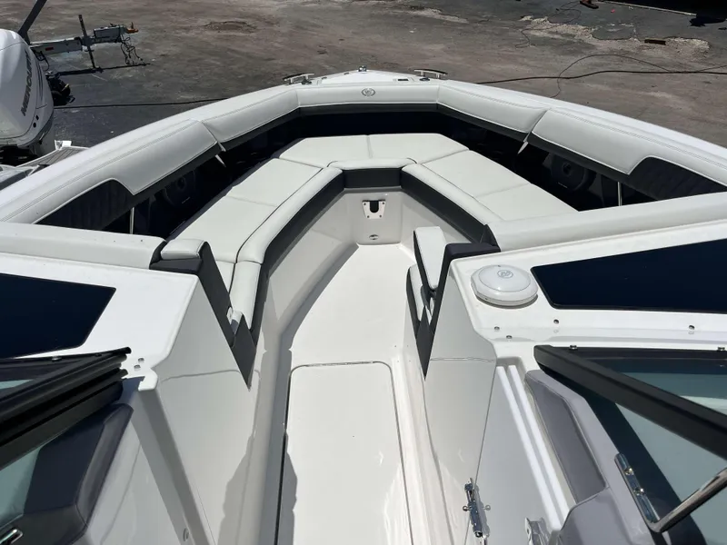 Slide: The Image of 2023 Cobalt R33 boat interior with white seating and sleek design. - 5